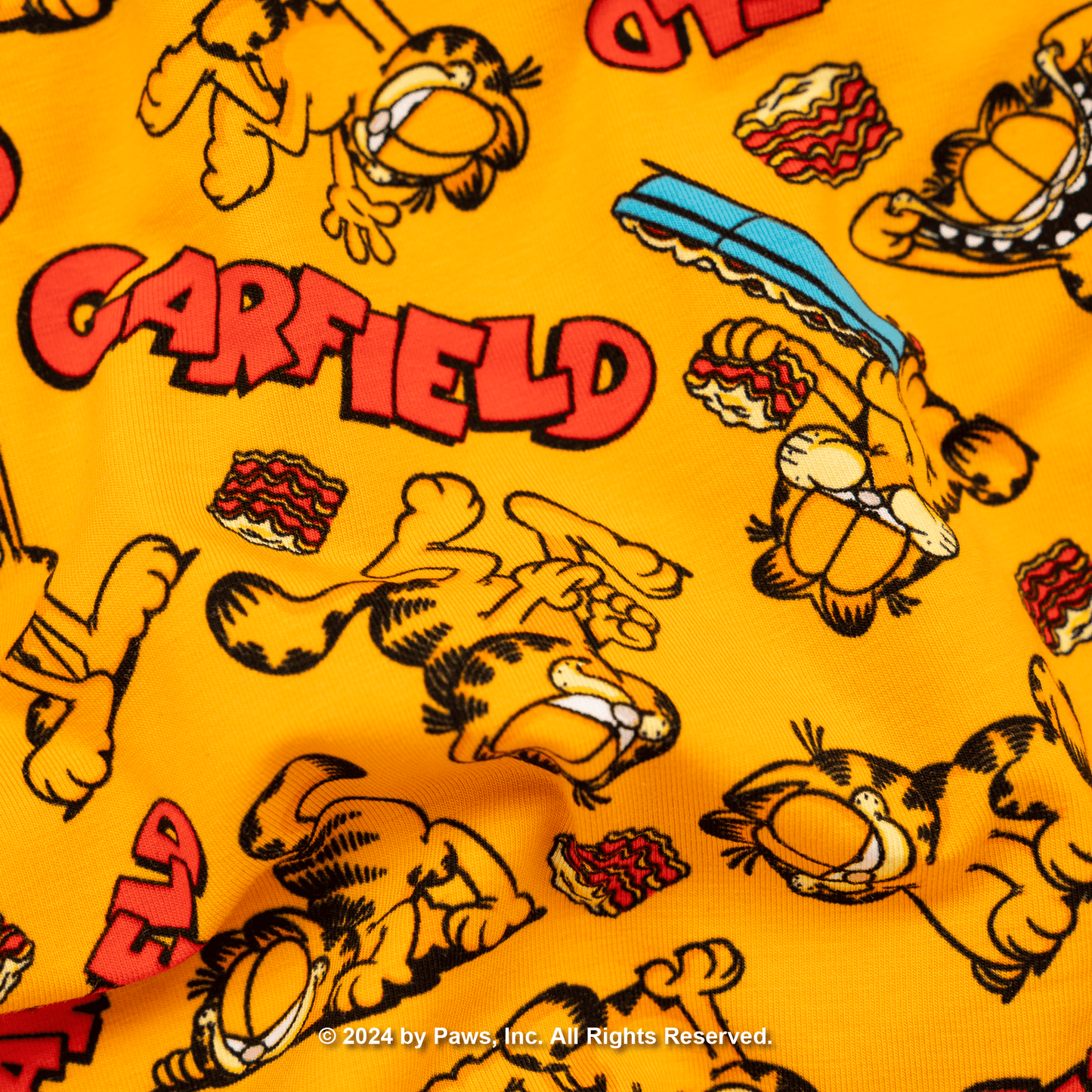 Pattern of Garfield the cat on a yellow background with 'Garfield' text.