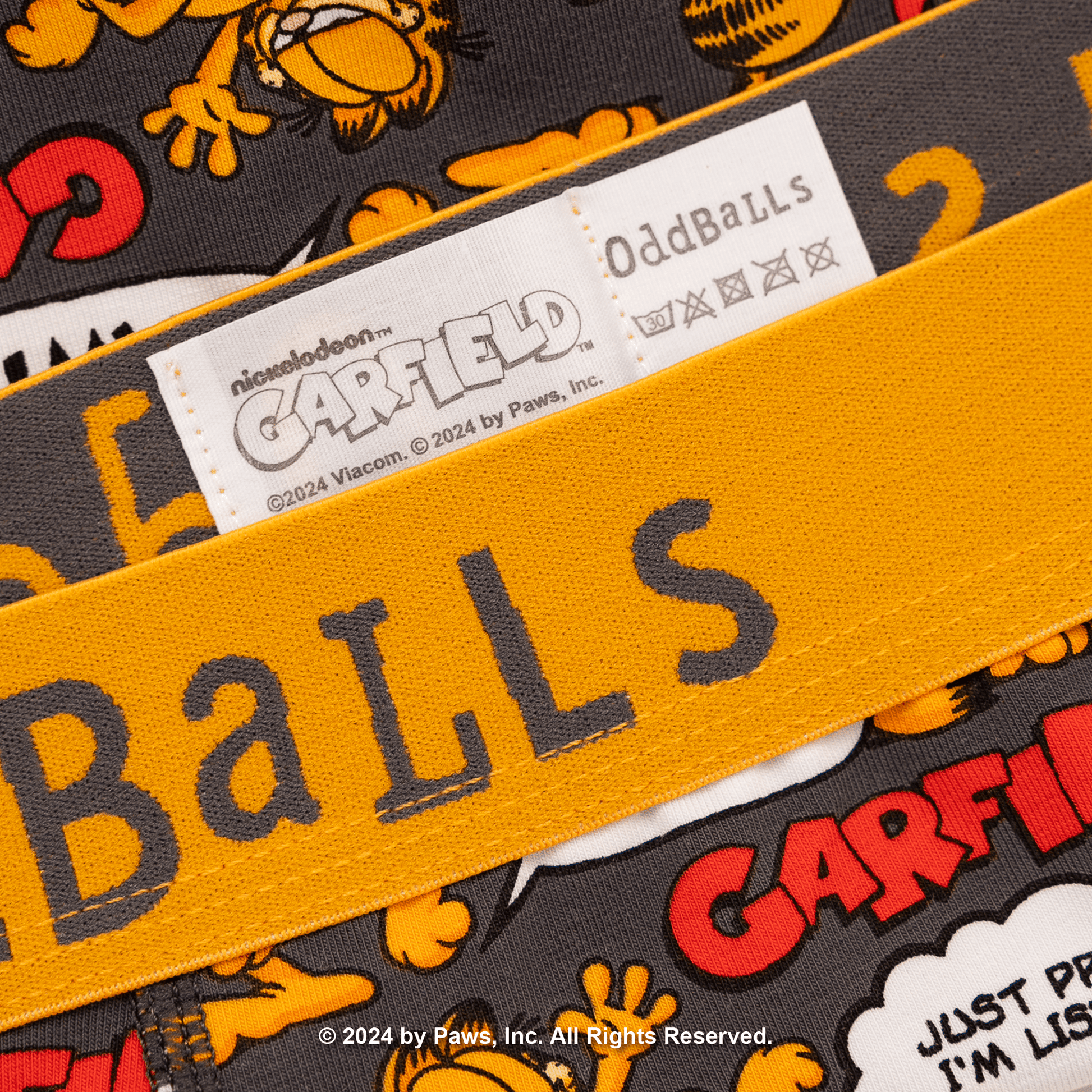 Close-up of a product with 'Garfield' branding and text, featuring the brand name 'OddBalls'.