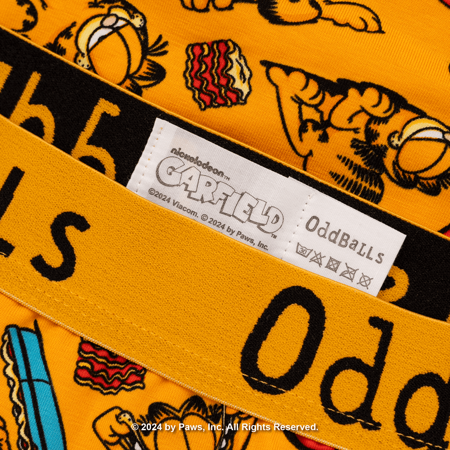 Close-up of a product with 'Garfield' branding and a label on an orange background.